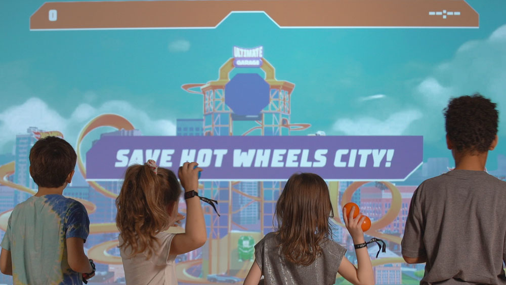 Children playing 'Save Hot Wheels City' at Hot Wheels Champion Experience